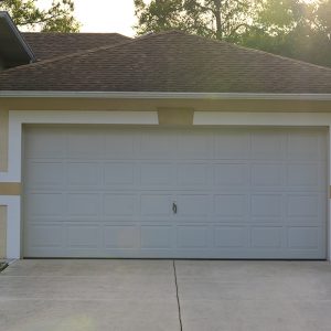 Close-up image of a white residential garage door.